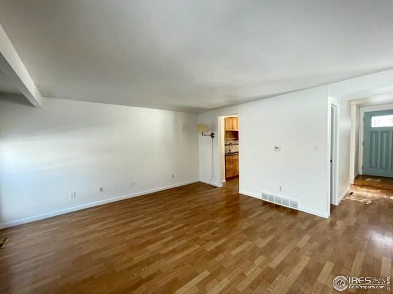 1187 Bear Mountain Drive, Unit A Boulder, CO 80305 - Photo 13 of 26 wooden floor in an empty room
