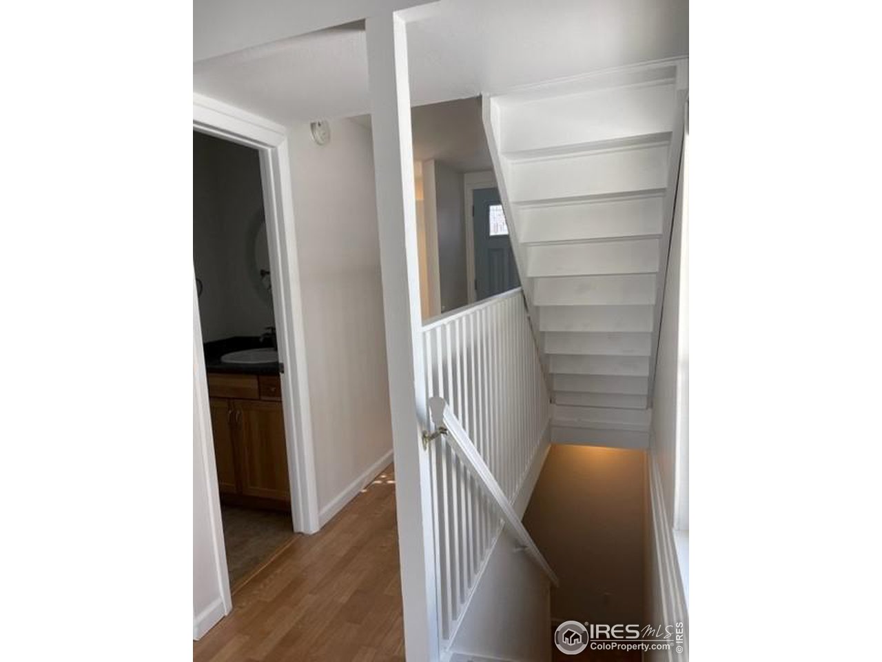 1187 Bear Mountain Drive, Unit A Boulder, CO 80305 - Photo 15 of 26 a view of hallway with stairs and wooden floor