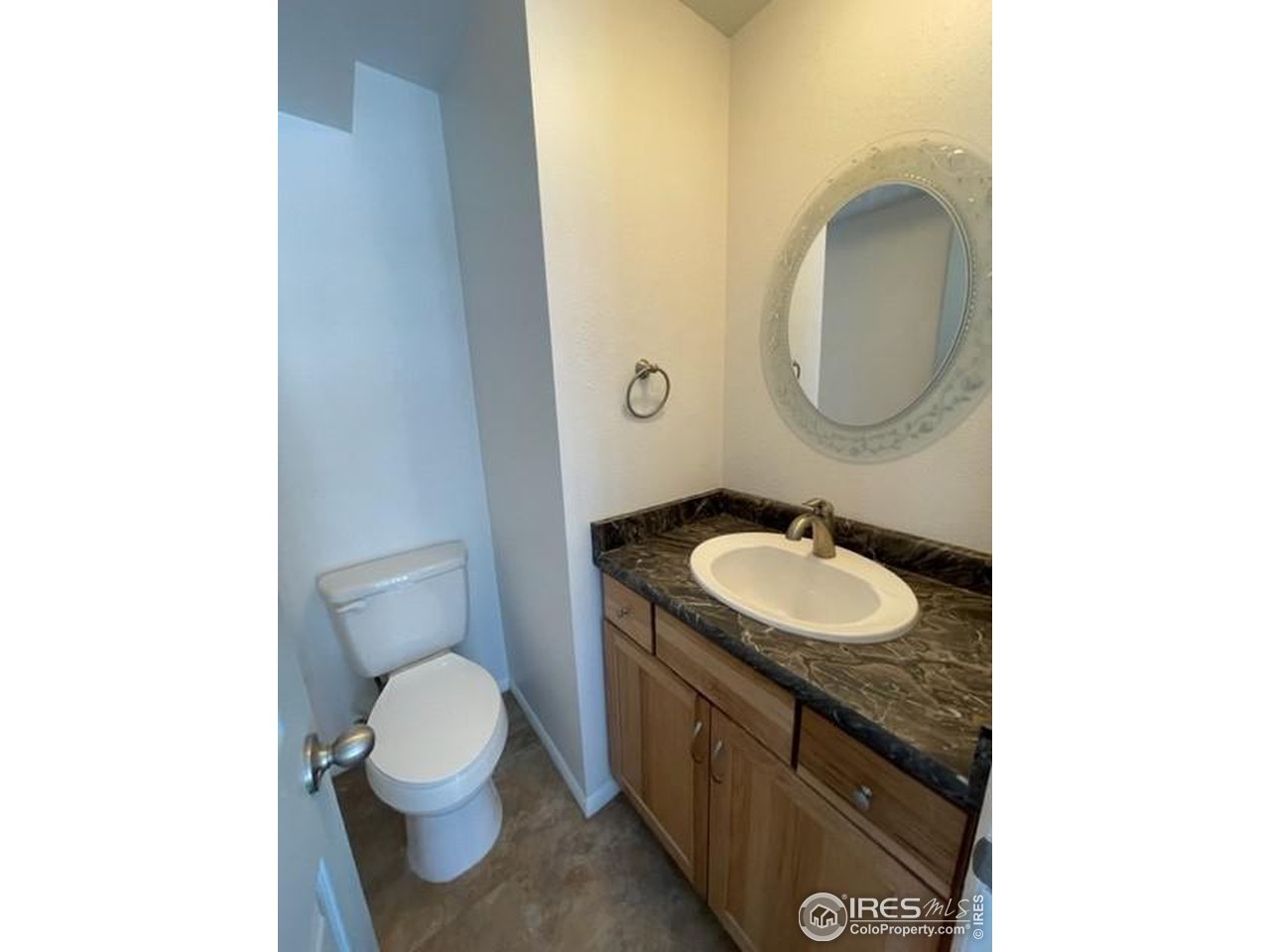 1187 Bear Mountain Drive, Unit A Boulder, CO 80305 - Photo 16 of 26 a bathroom with a toilet sink and mirror