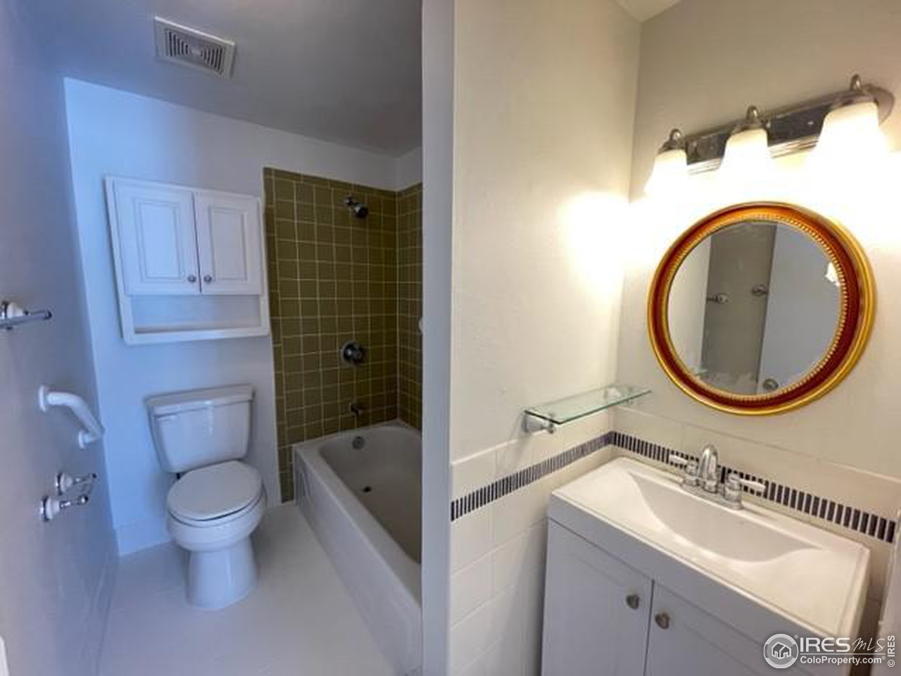 1187 Bear Mountain Drive, Unit A Boulder, CO 80305 - Photo 24 of 26 a bathroom with a granite countertop toilet a sink and a bathtub