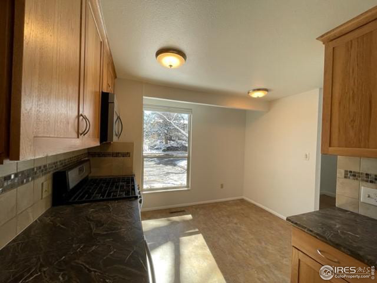 1187 Bear Mountain Drive, Unit A Boulder, CO 80305 - Photo 10 of 26 a view of an empty room and window