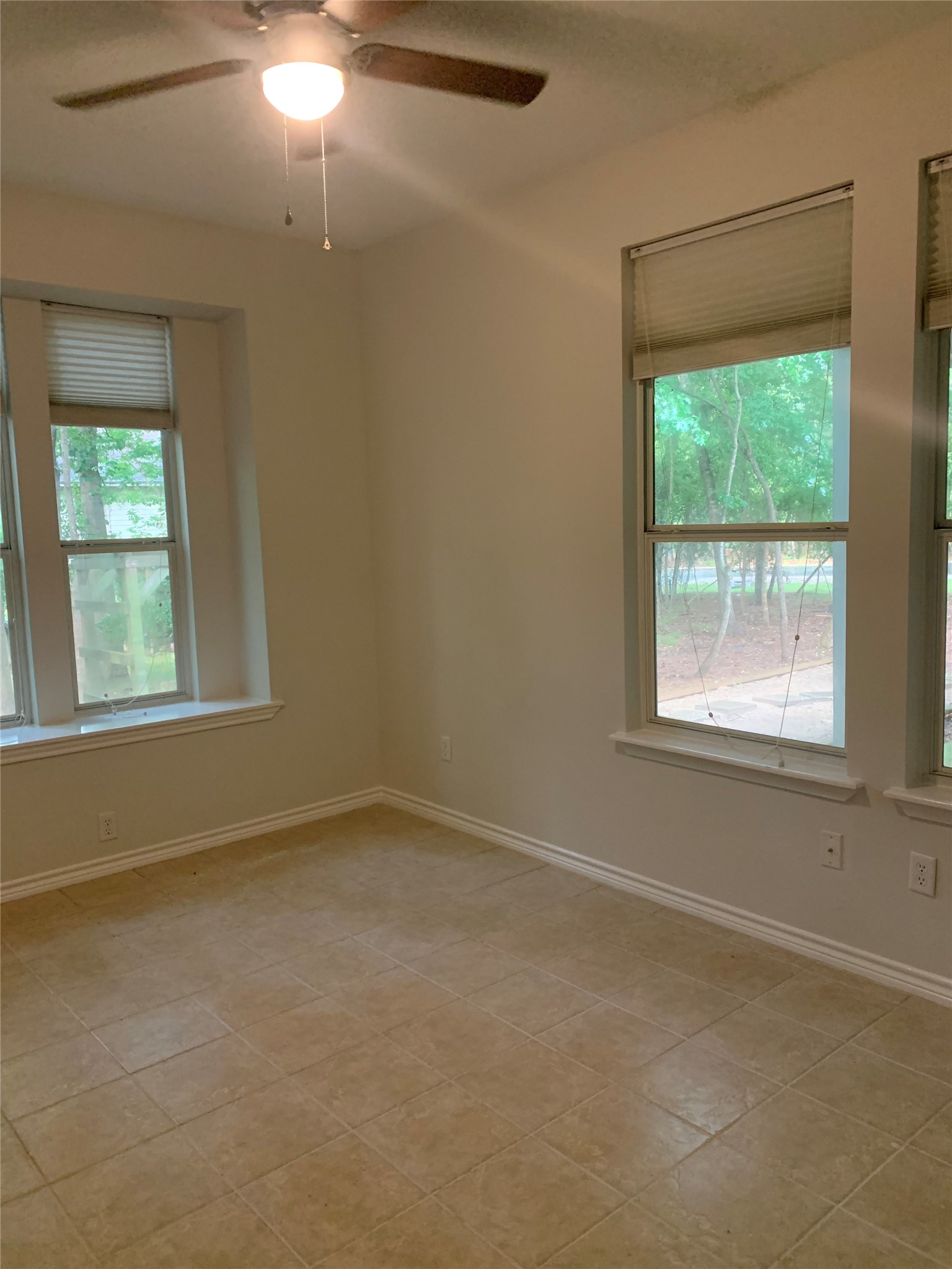 11 Lords Circle Coldspring, TX 77331 - Photo 20 of 26 Fourth bedroom with large windows allowing in plenty of sunlight.