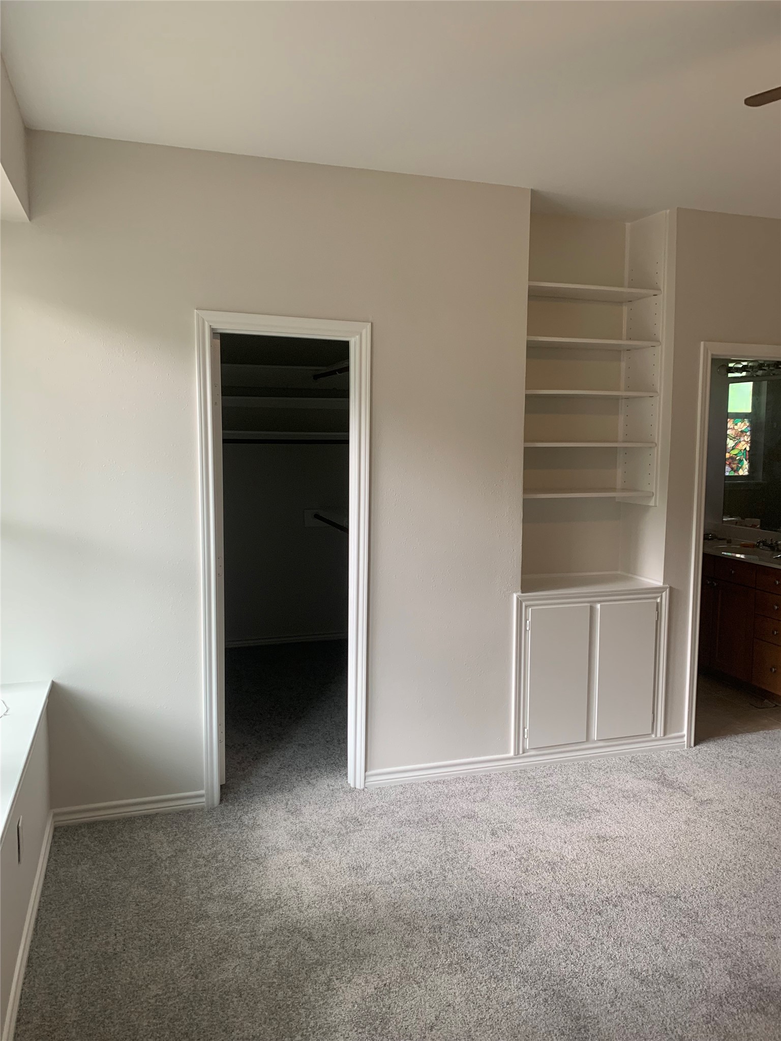 11 Lords Circle Coldspring, TX 77331 - Photo 4 of 26 Primary bedroom with entry into closet and shelves for extra storage