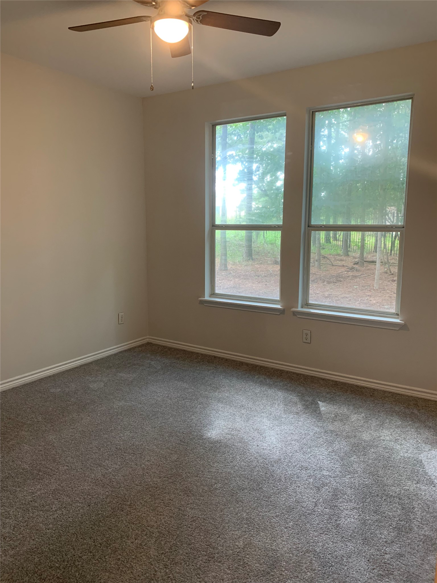 11 Lords Circle Coldspring, TX 77331 - Photo 7 of 26 Secondary bedroom with large windows for sunlight to enter the room.