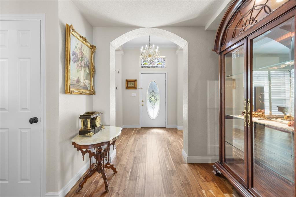 1007 Santa Fe Street Denton, TX 76205 - Photo 4 of 37 a view of a hallway view with wooden floor and staircase
