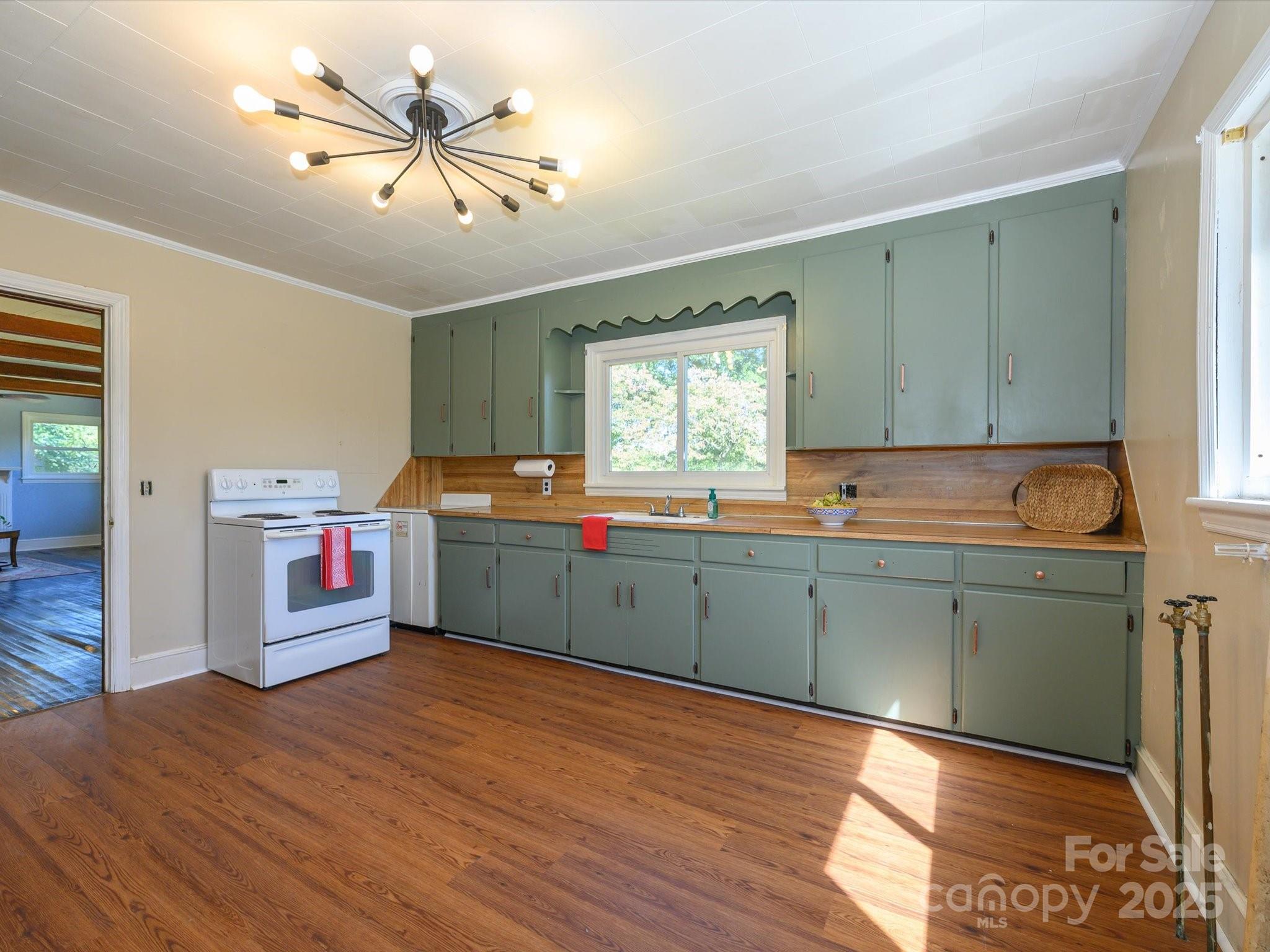 7022 White Store Road Marshville, NC 28103 - Photo 11 of 26 a kitchen with cabinets a sink and appliances