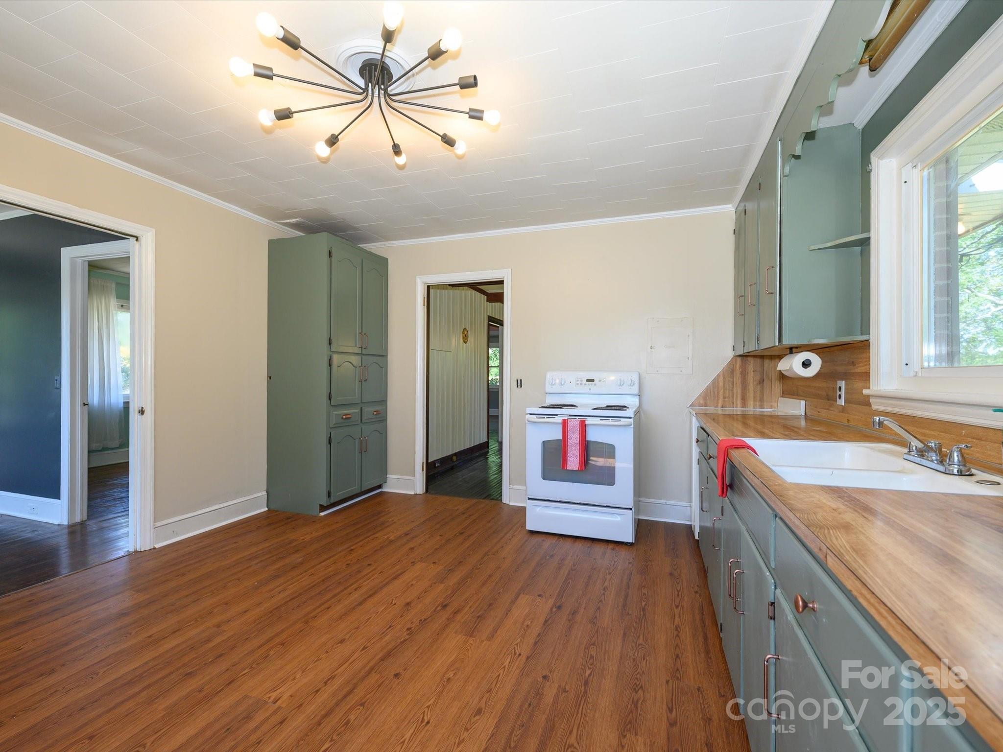 7022 White Store Road Marshville, NC 28103 - Photo 13 of 26 a kitchen that has a sink and cabinets
