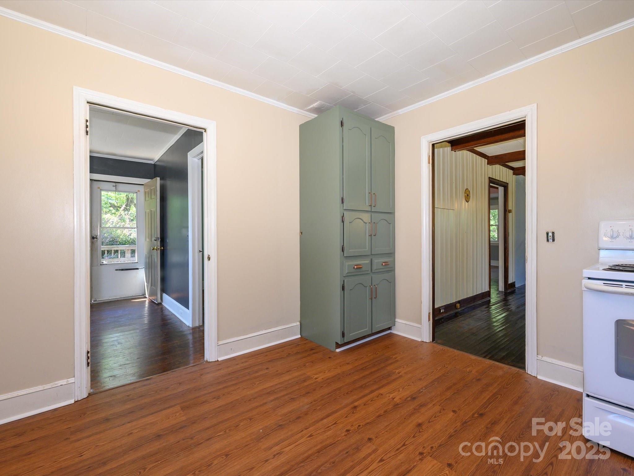 7022 White Store Road Marshville, NC 28103 - Photo 14 of 26 a view of a hallway with wooden floor and a bathroom