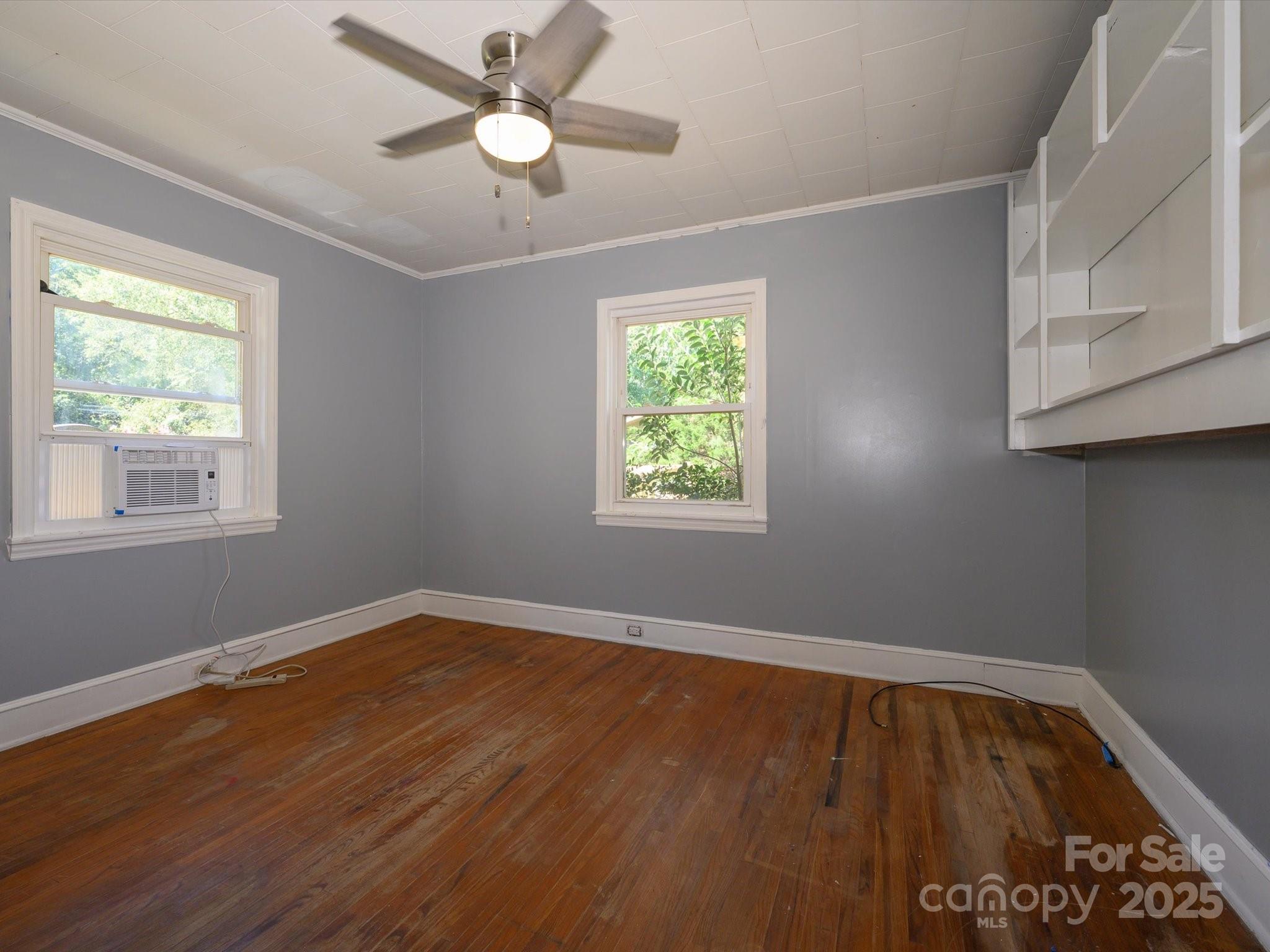 7022 White Store Road Marshville, NC 28103 - Photo 20 of 26 a view of an empty room with wooden floor and a window