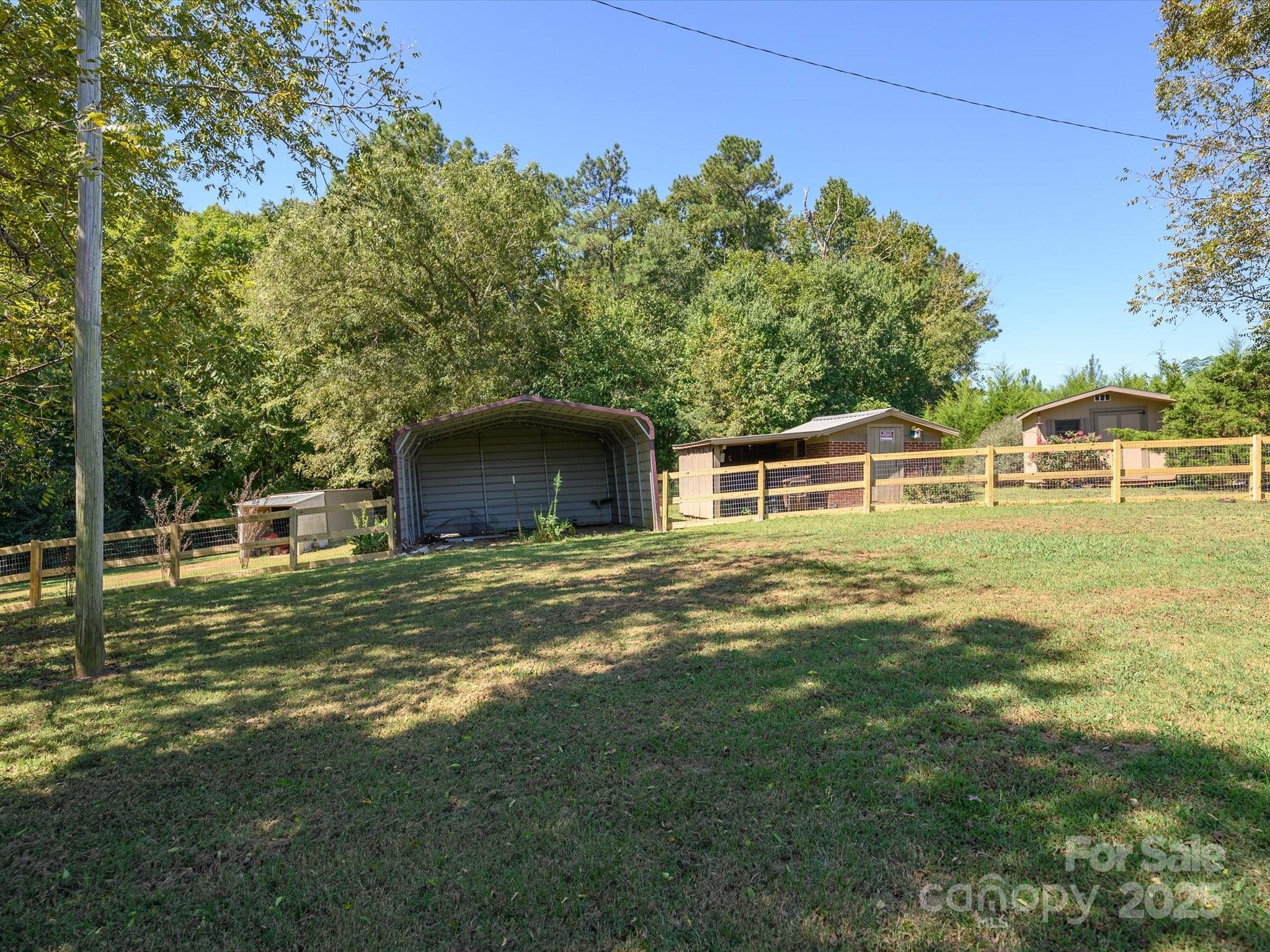 7022 White Store Road Marshville, NC 28103 - Photo 25 of 26 a view of a house with a yard