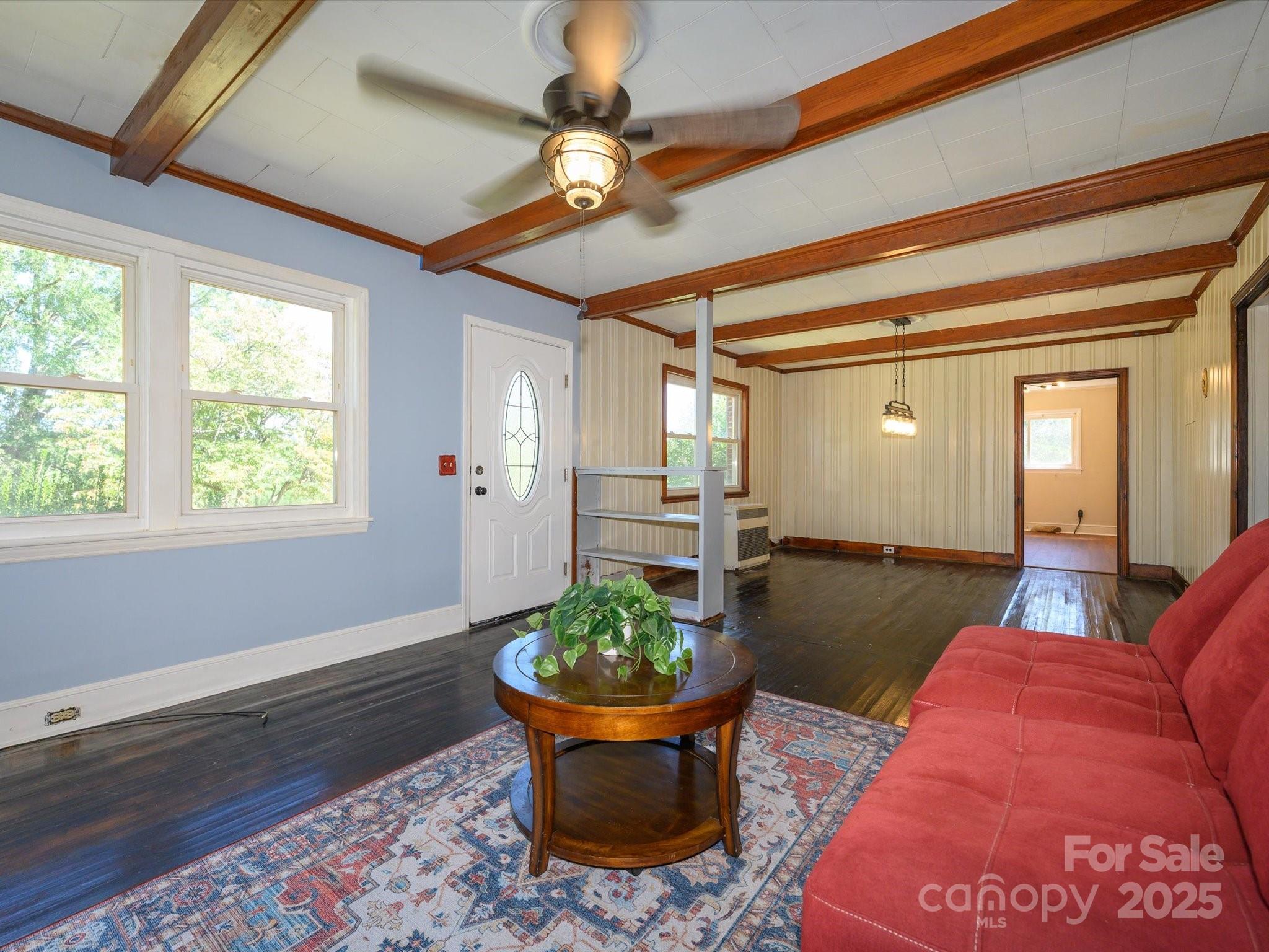7022 White Store Road Marshville, NC 28103 - Photo 4 of 26 a living room with a couch and a table
