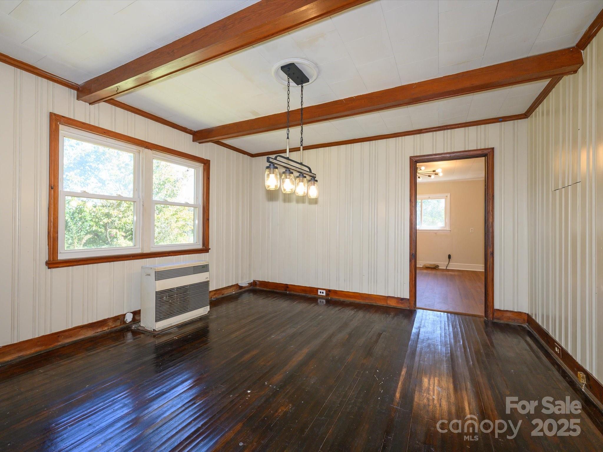 7022 White Store Road Marshville, NC 28103 - Photo 8 of 26 a view of empty room with wooden floor and fan
