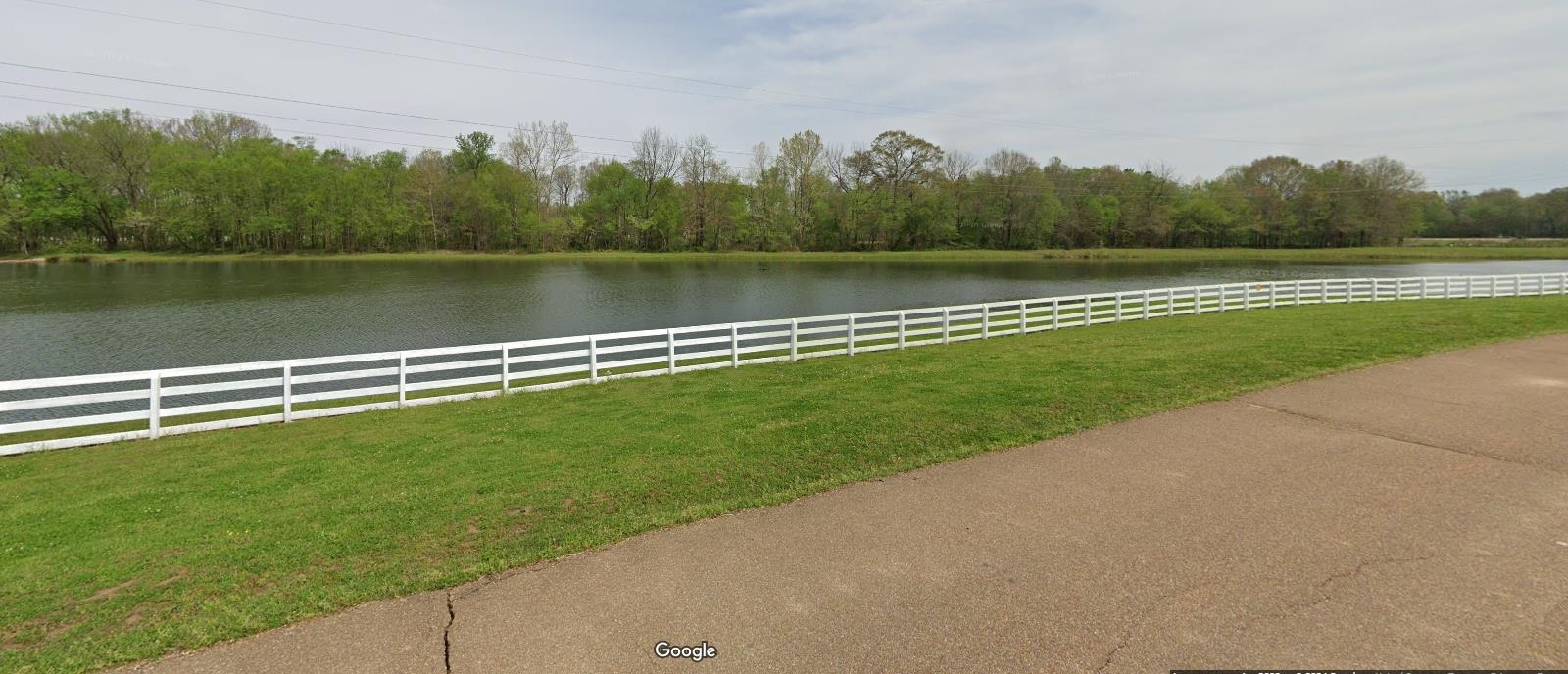 11760 Stable View Drive Eads, TN 38028 - Photo 3 of 8 a view of a lake with a big yard and a large mountain view
