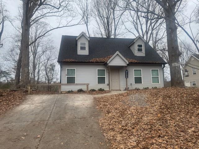 5376 Archer Avenue Cumming, GA 30041 - Photo 1 of 16 a front view of a house with a garden