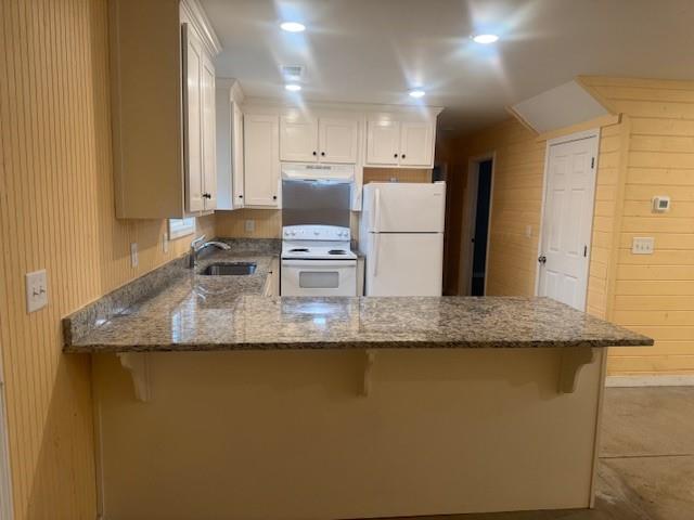 5376 Archer Avenue Cumming, GA 30041 - Photo 5 of 16 a kitchen with granite countertop a sink a refrigerator and a stove
