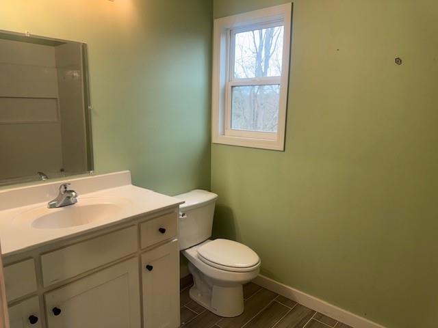 5376 Archer Avenue Cumming, GA 30041 - Photo 10 of 16 a bathroom with a toilet a sink and mirror