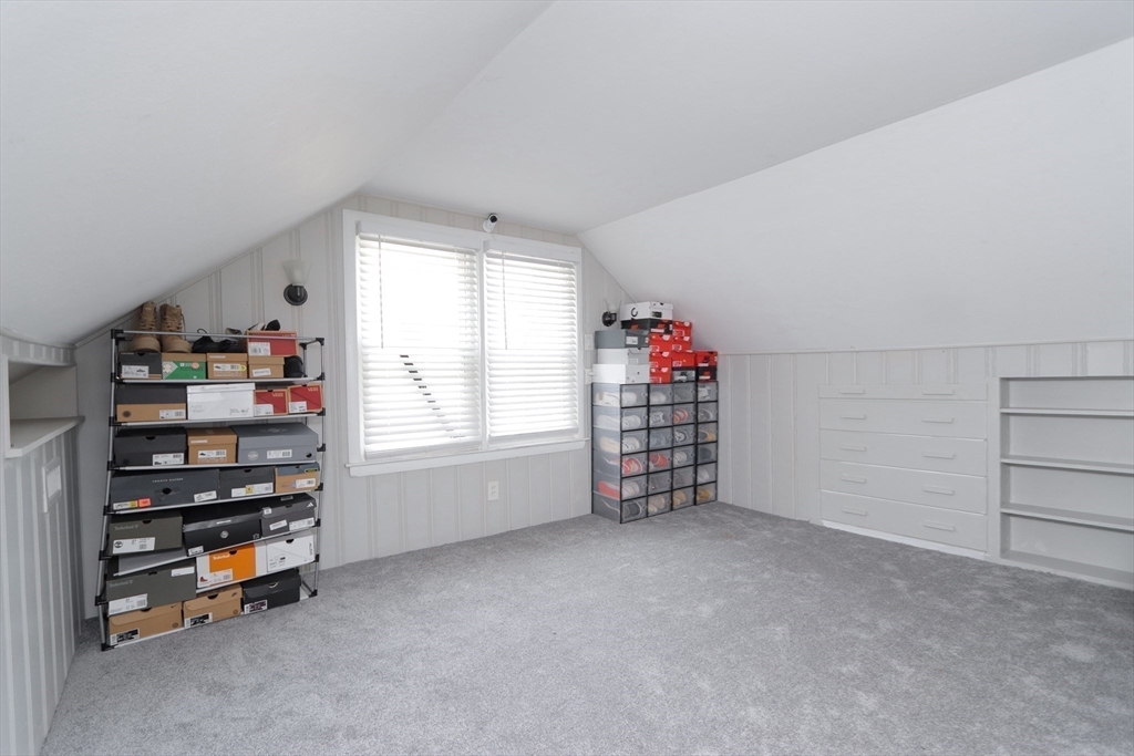 114 Davis Street Springfield, MA 01104 - Photo 30 of 42 a view of an empty room with shelves and a window