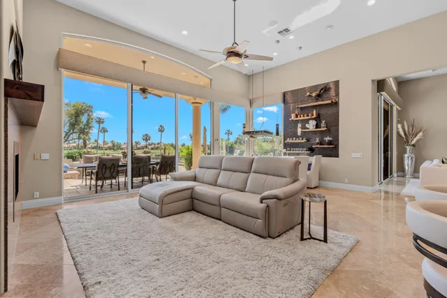 a kitchen with stainless steel appliances kitchen island granite countertop a sink and cabinets