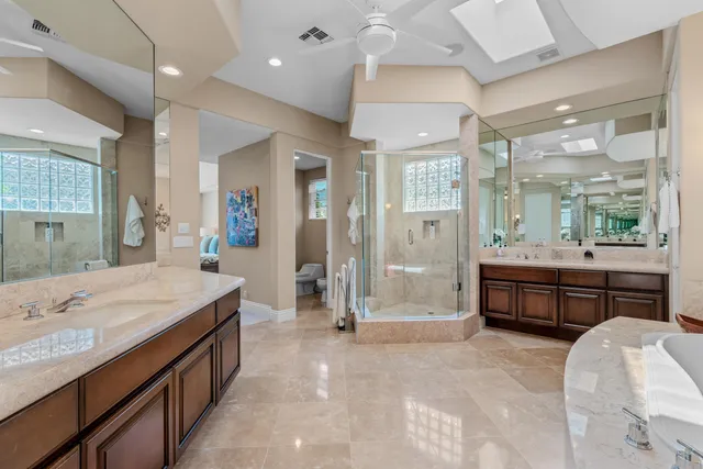 a bathroom with a granite countertop sink mirror and a