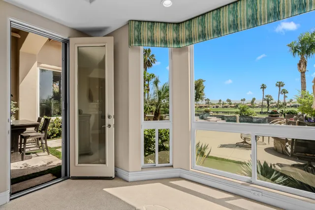 a view of a house with swimming pool garden and patio