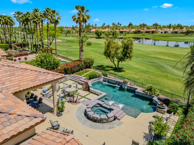 a aerial view of a house with a garden and outdoor space