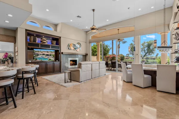 a living room with furniture and kitchen view