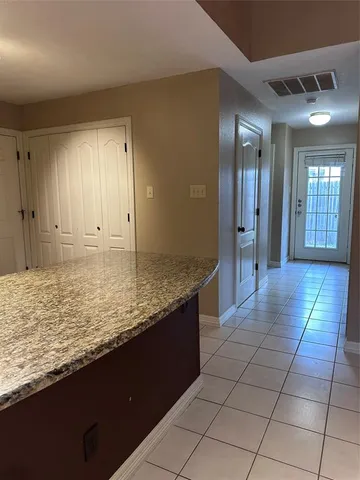 a large bathroom with a sink vanity and mirror