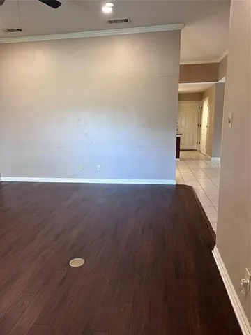 a view of a livingroom with a ceiling fan and window