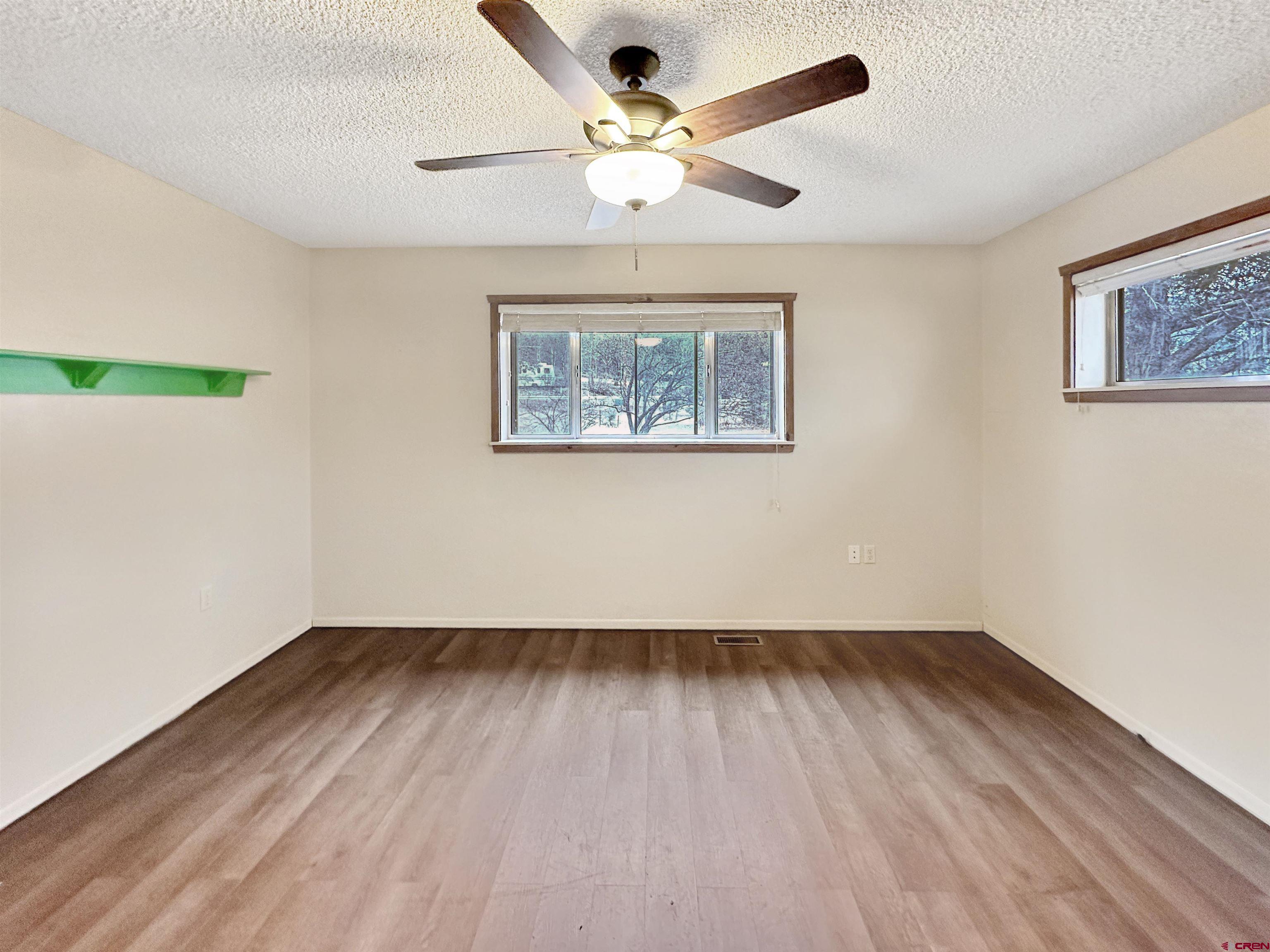6644 County Road 203 Durango, CO 81301 - Photo 18 of 21 a view of an empty room with wooden floor