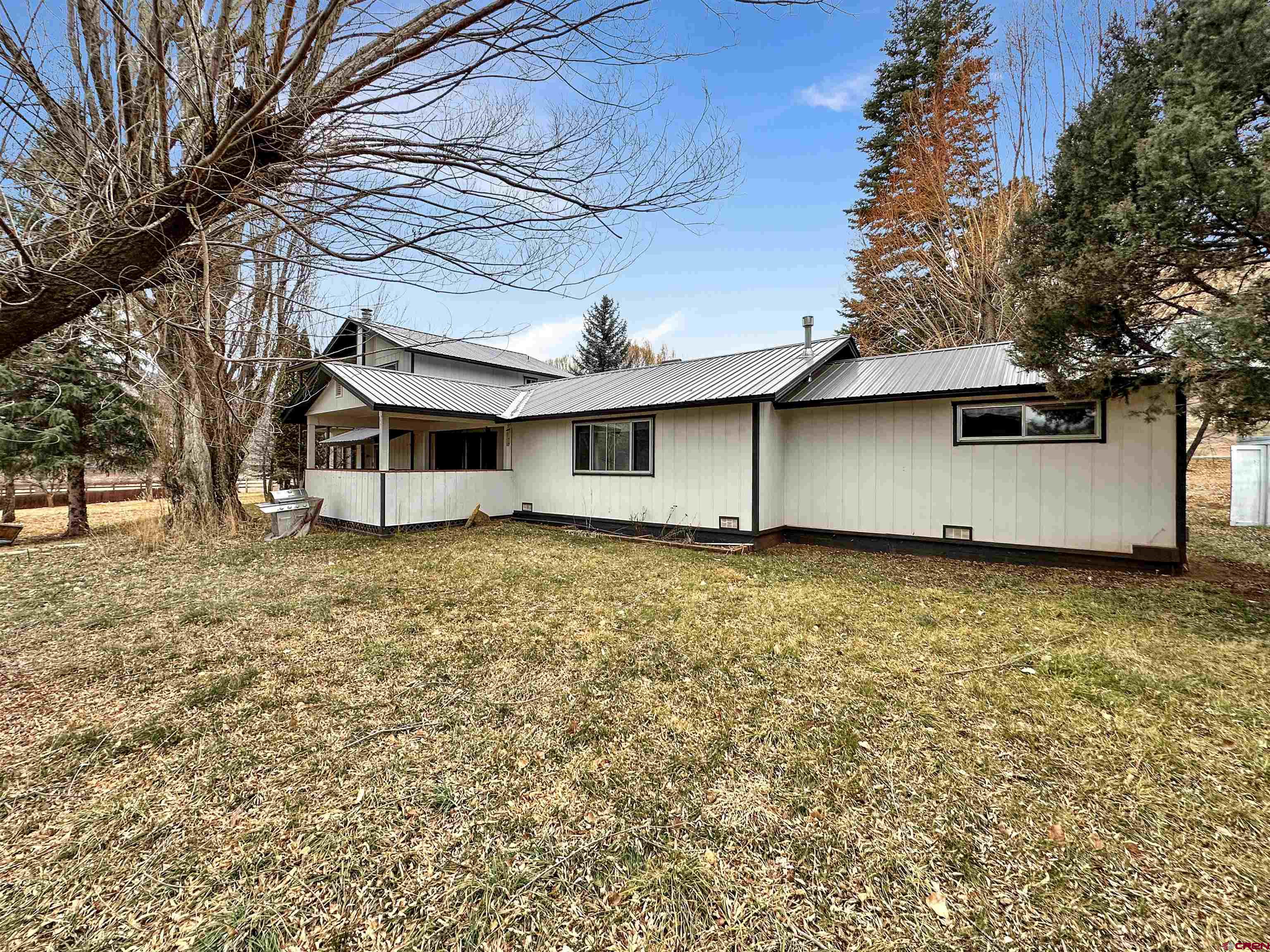 6644 County Road 203 Durango, CO 81301 - Photo 5 of 21 a house with trees in the background