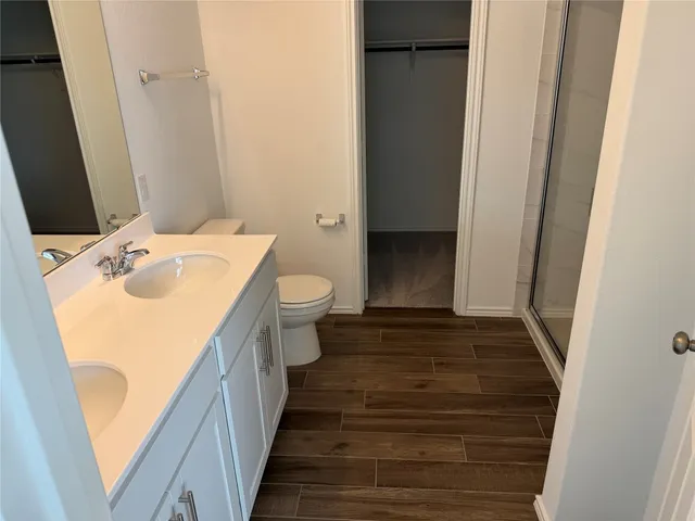 a bathroom with a sink and toilet