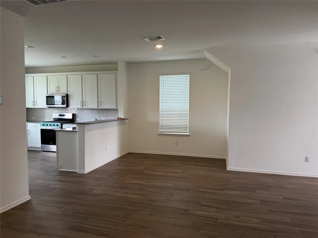 a view of kitchen with wooden floor