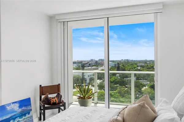 a living room with couch and a window