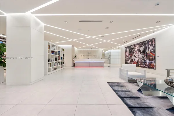 a living room with furniture and white walls