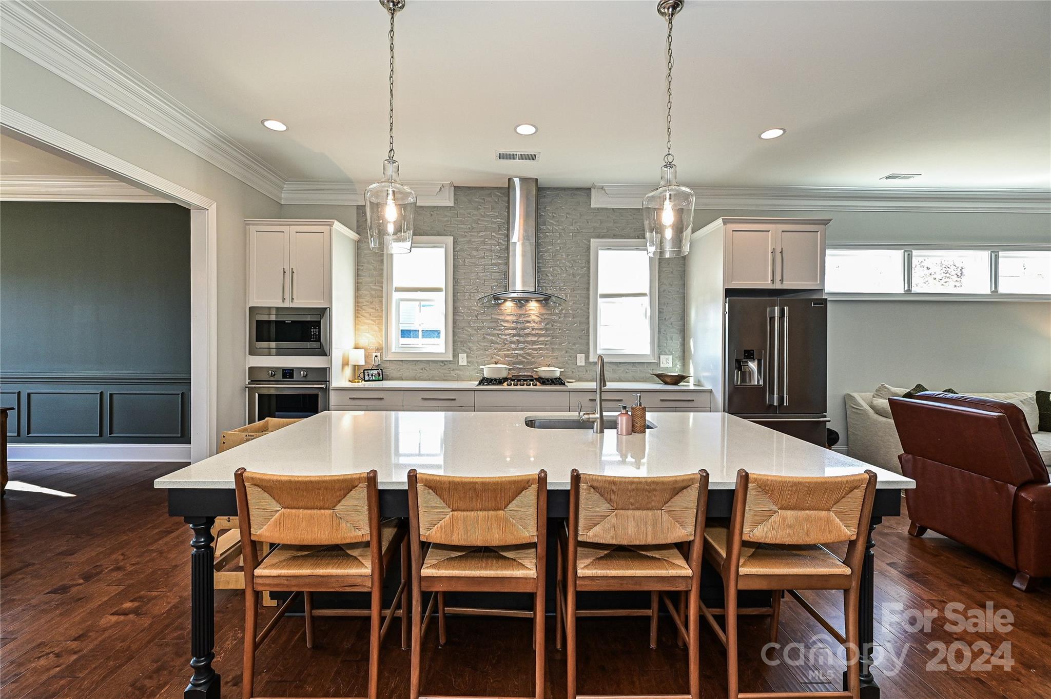 570 Crawfish Drive Fort Mill, SC 29708 - Photo 11 of 37 a dining room with stainless steel appliances kitchen island granite countertop a dining table chairs and a refrigerator