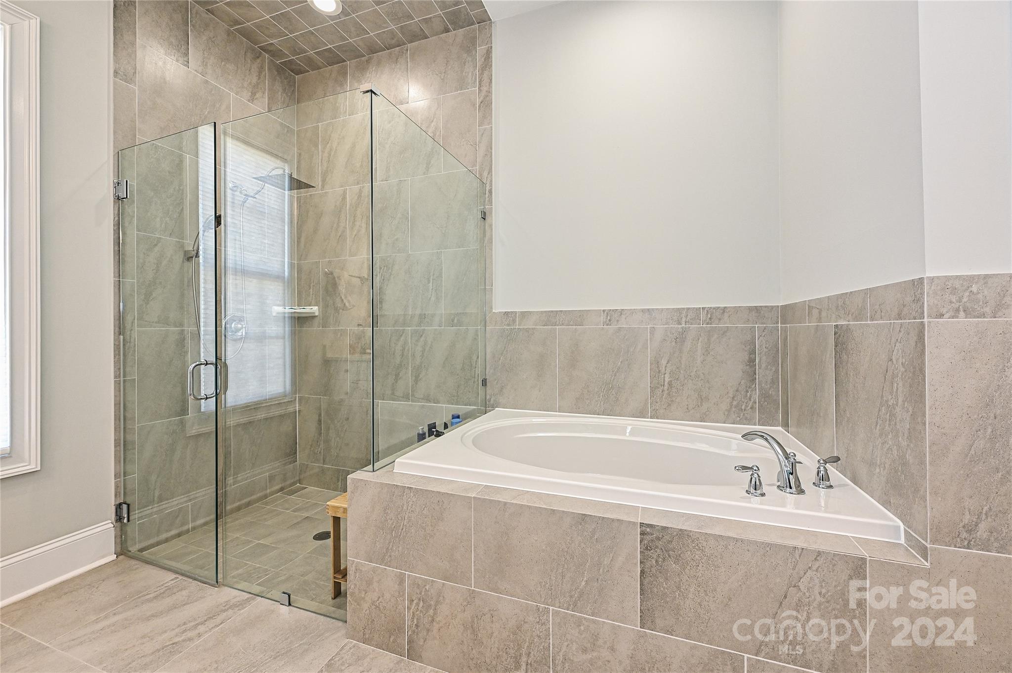 570 Crawfish Drive Fort Mill, SC 29708 - Photo 17 of 37 a spacious bathroom with a bathtub and shower