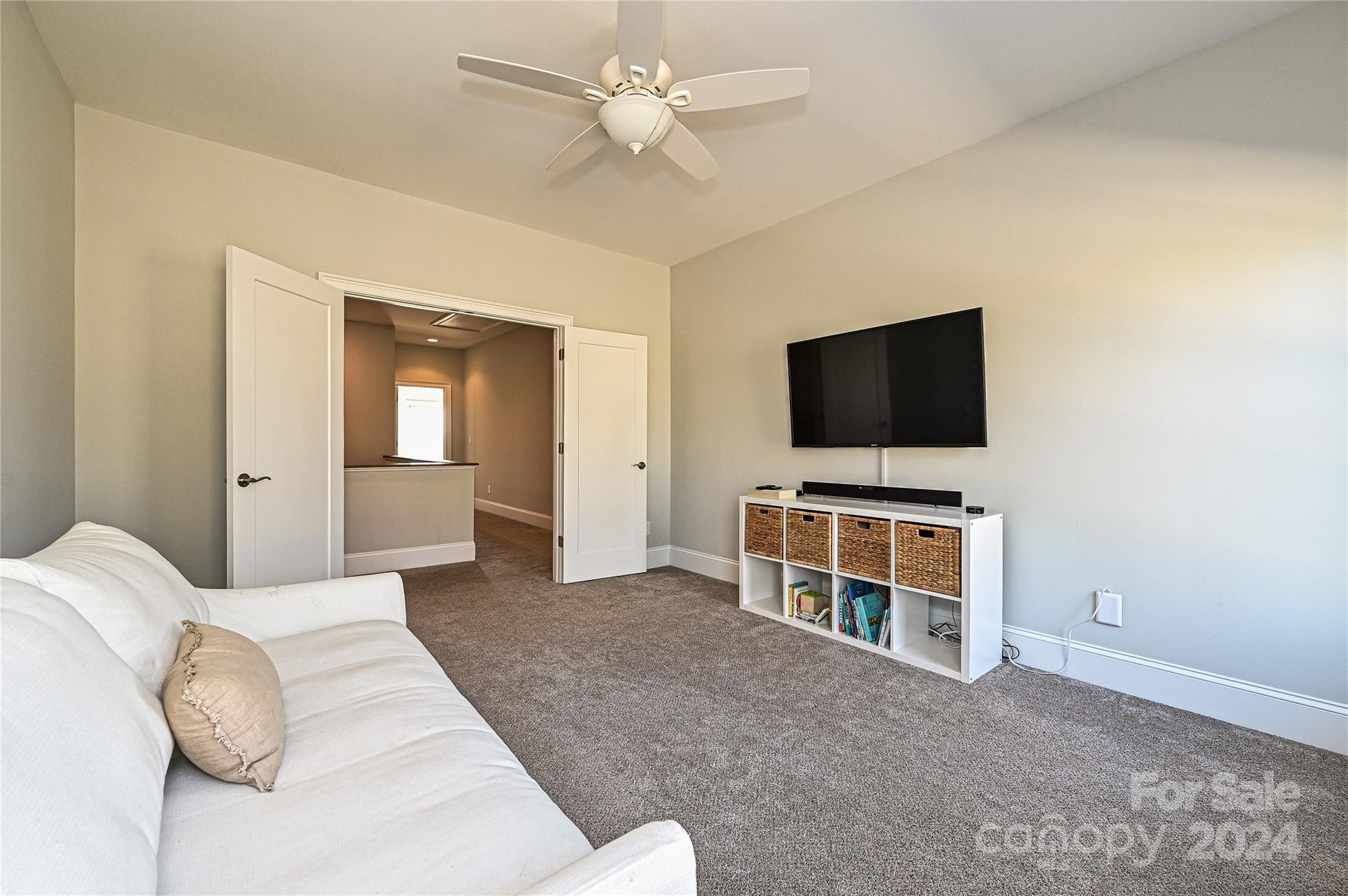 570 Crawfish Drive Fort Mill, SC 29708 - Photo 24 of 37 a bedroom with a bed and a flat screen tv