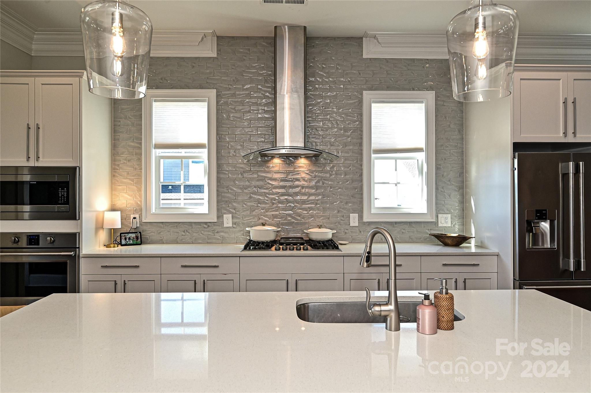 570 Crawfish Drive Fort Mill, SC 29708 - Photo 7 of 37 a kitchen with granite countertop a sink and a stove top oven