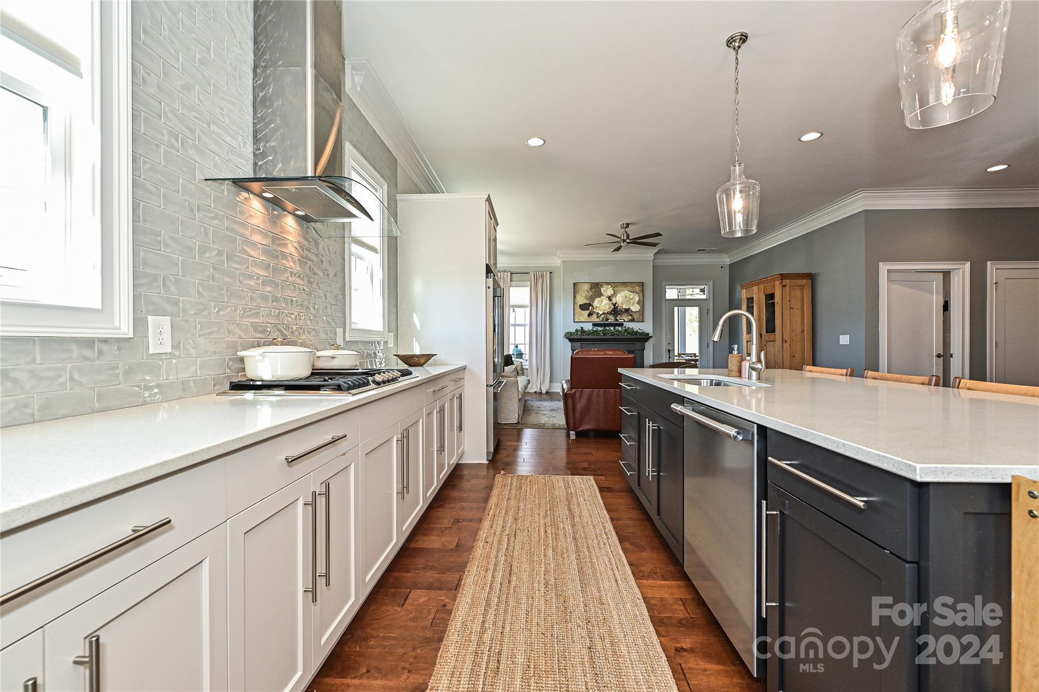 570 Crawfish Drive Fort Mill, SC 29708 - Photo 9 of 37 a large kitchen with stainless steel appliances kitchen island granite countertop a large counter top and sink