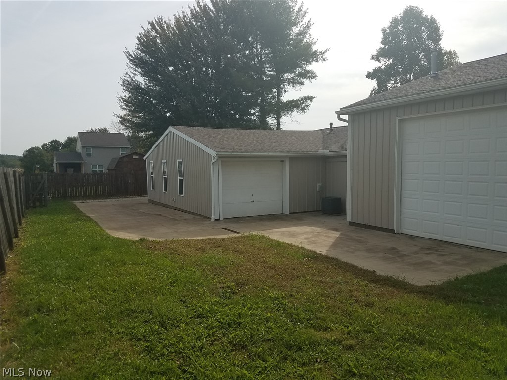 2159 Meloy Road Kent, OH 44240 - Photo 31 of 33 This is the rear of the property. The large door enters the large garage space. The small garage door is a small garage that would be great storage for the suite, or maybe a place for your motorcycle/toys.