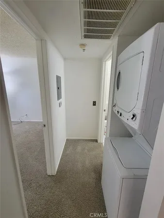 a bathroom with a sink and mirror with toilet
