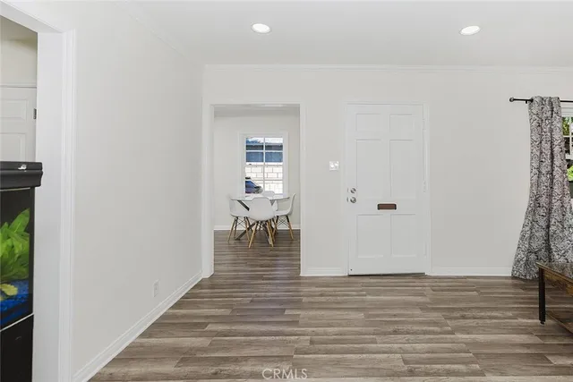 a view of wooden floor and closet in a room