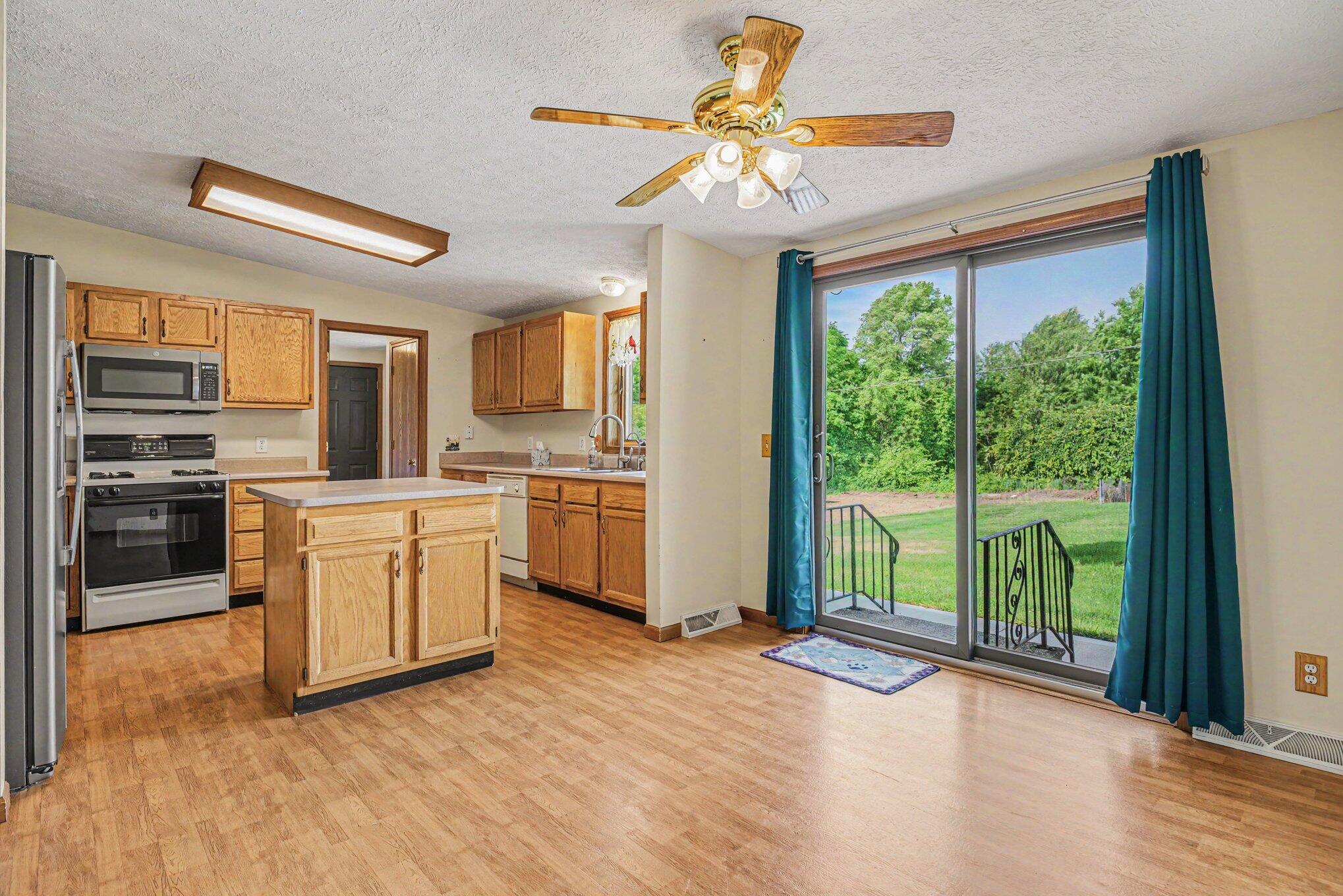 69728 Calvin Center Road Edwardsburg, MI 49112 - Photo 7 of 26 69728 Calvin Center Rd.Kitchen.DR.Patio