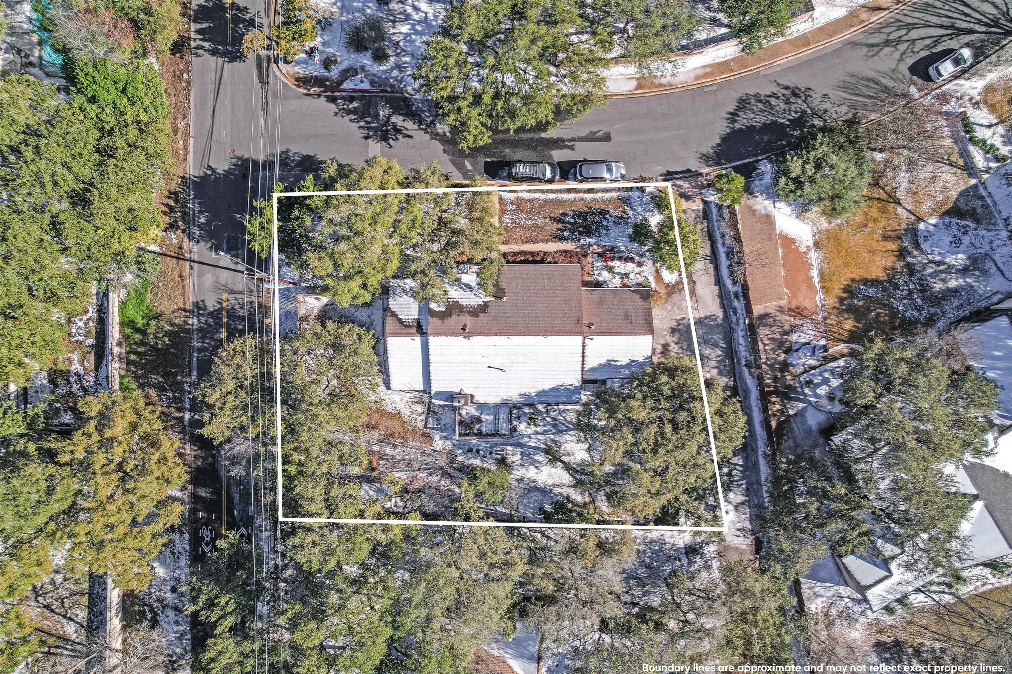 3207 Eanes Circle Austin, TX 78746 - Photo 3 of 21 Large corner lot has SF3 zoning for future development options. Permitted plans for two new construction homes may convey with the sale.