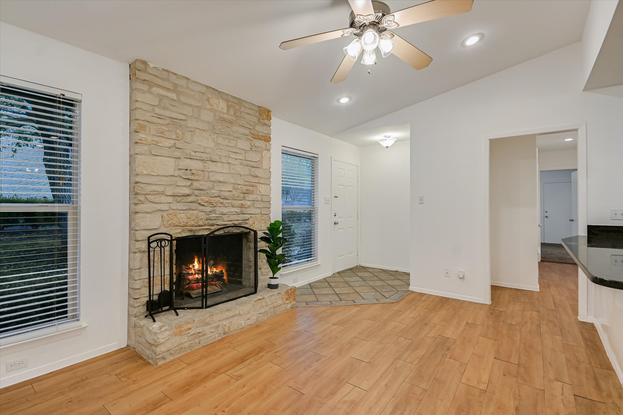 3207 Eanes Circle Austin, TX 78746 - Photo 7 of 21 Unit A fireplace and entry - open to kitchen