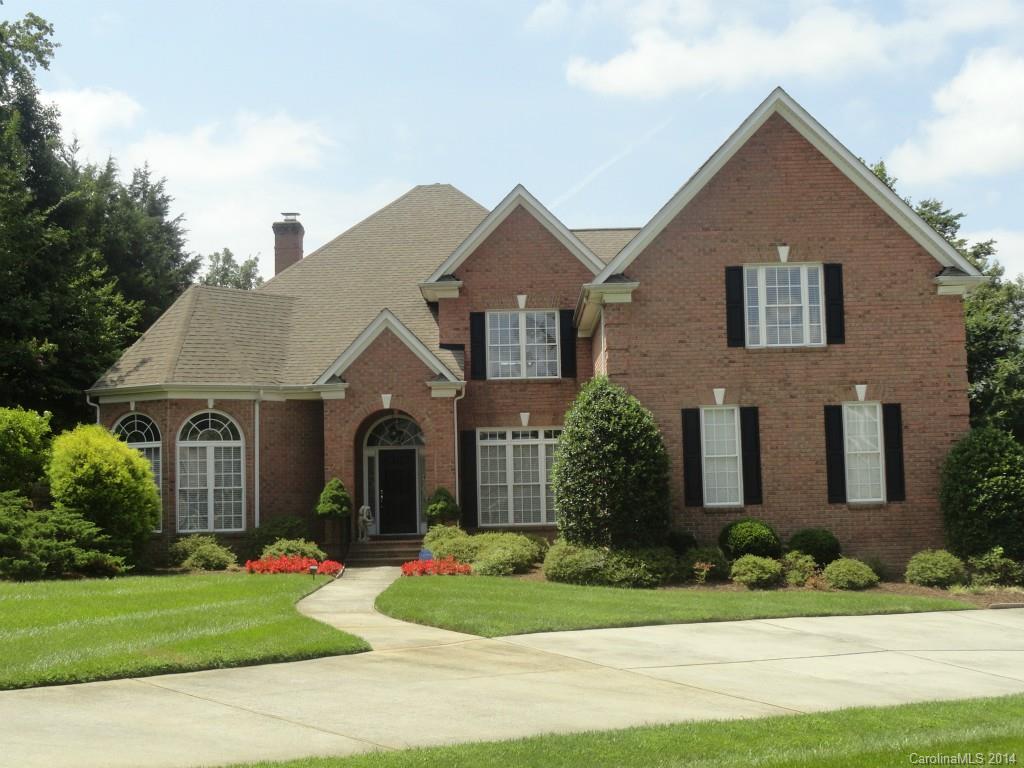 3237 Planters Ridge Road Charlotte, NC 28270 - Photo 1 of 24 a front view of a house with a yard and garage