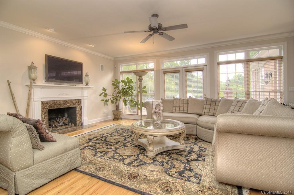 3237 Planters Ridge Road Charlotte, NC 28270 - Photo 12 of 24 a living room with furniture fireplace and a large window
