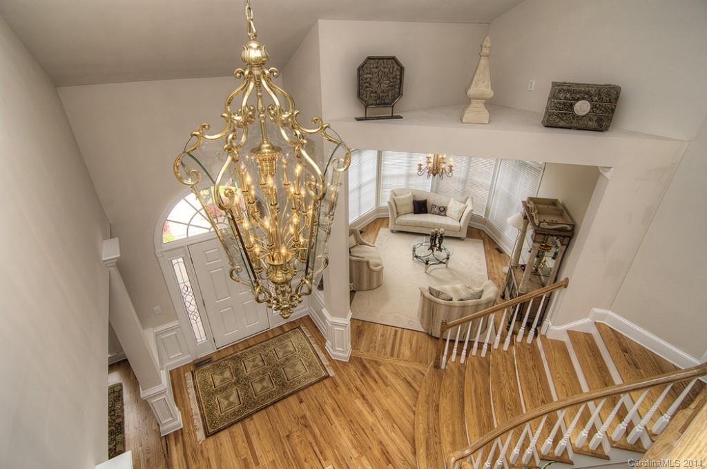 3237 Planters Ridge Road Charlotte, NC 28270 - Photo 3 of 24 a view of a dining room with furniture and wooden floor