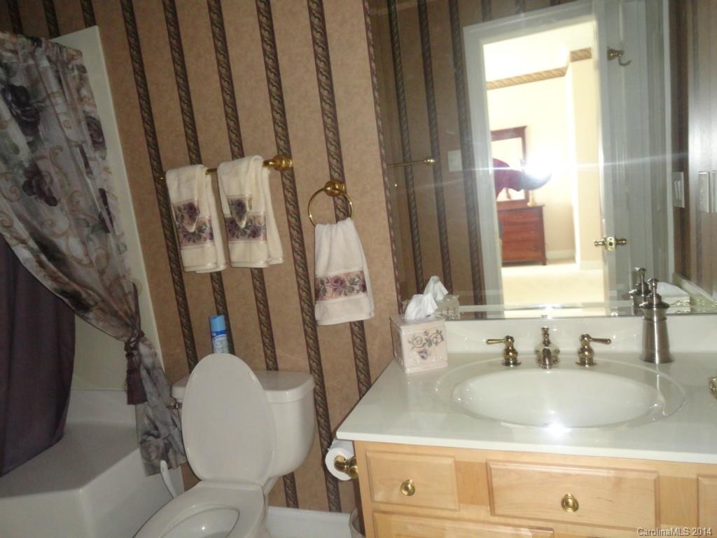 3237 Planters Ridge Road Charlotte, NC 28270 - Photo 21 of 24 a bathroom with a granite countertop sink toilet and shower