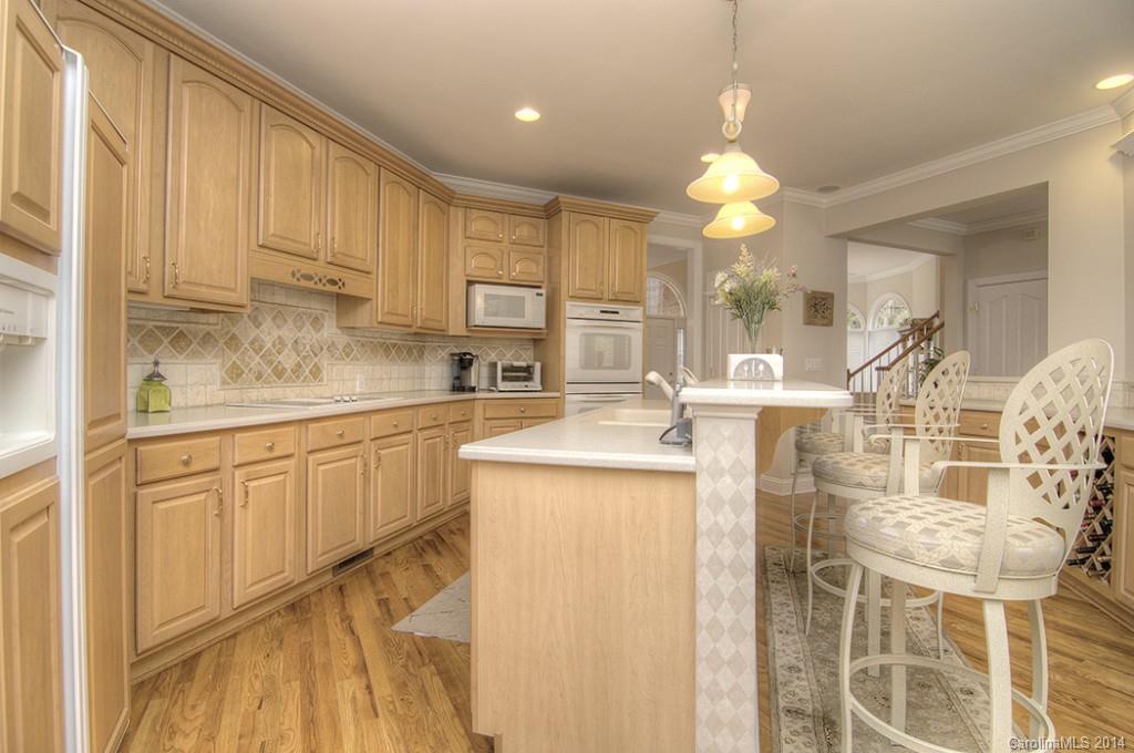 3237 Planters Ridge Road Charlotte, NC 28270 - Photo 8 of 24 a kitchen with cabinets and window